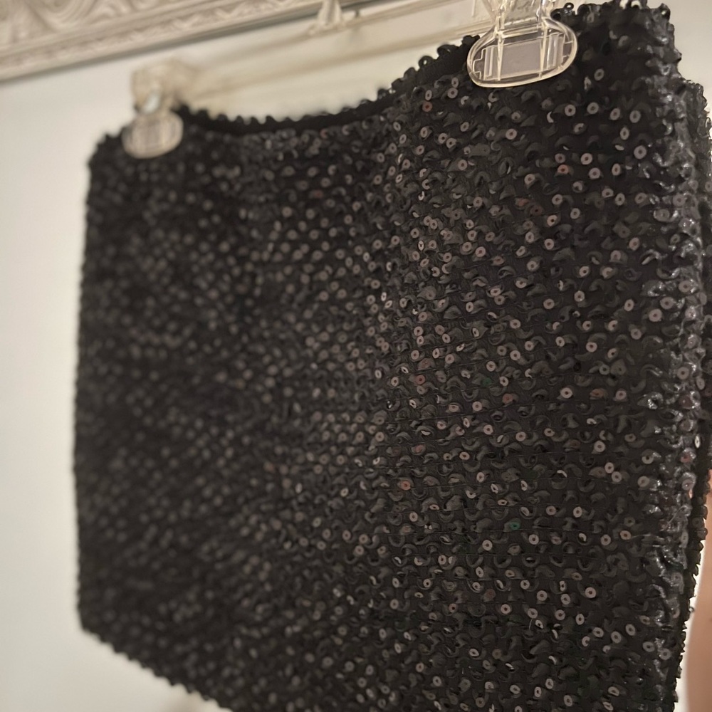 Black, sequined top. Worn once. Size small